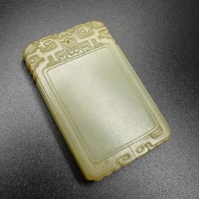 A Chinese celadon jade plaque/ pendant