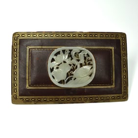 A Chinese pale celadon circular reticulated plaque
