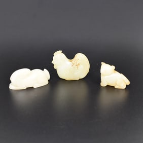 A grouping of three Chinese jade animal carvings