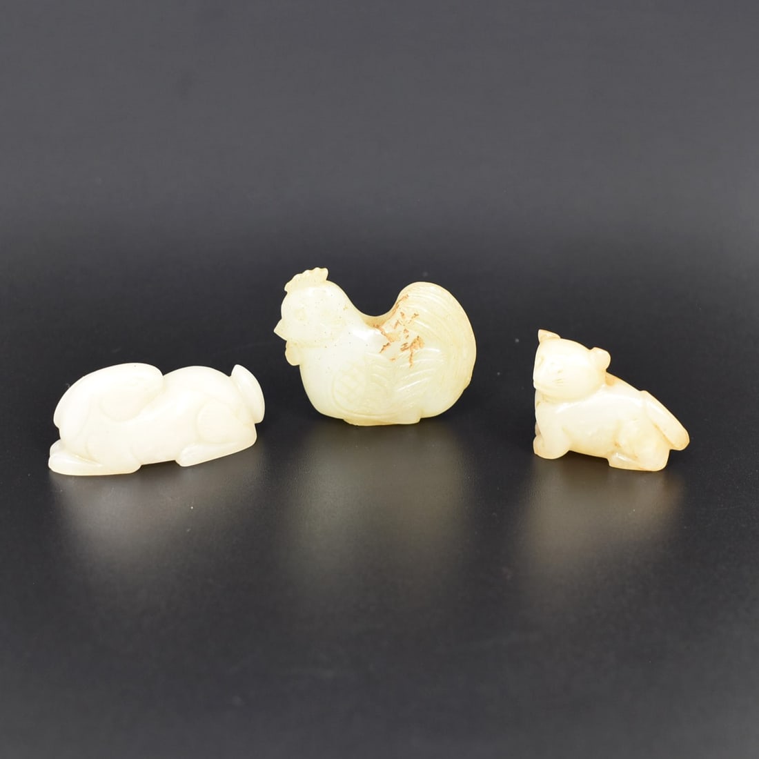 A grouping of three Chinese jade animal carvings (1 of 5)