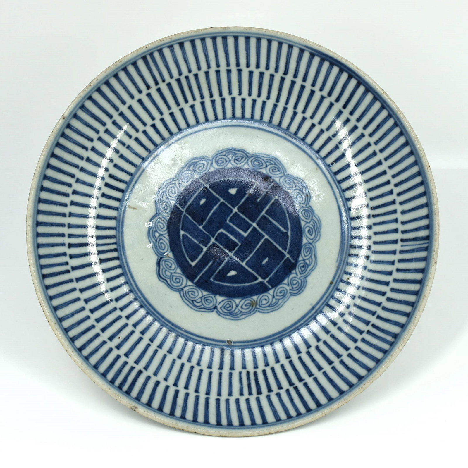 A Chinese Blue and white porcelain 'Shou' dish: A Chinese Blue and white porcelain 'Shou' longevity pattern dish. Approximate measurements: 1 7/8"H x 10" in diameter or 4.8cm H x 25.5cm in diameter