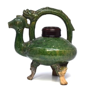 An antique chinese green-glazed zoomorphic tripod vessel