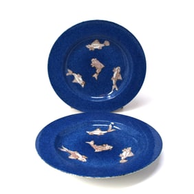 Pair of Chinese copper-red powder-blue-ground 'fish' dishes