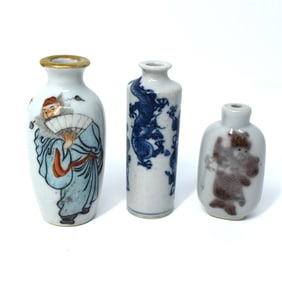A grouping of three Chinese porcelain items: two vases and a snuff bottle