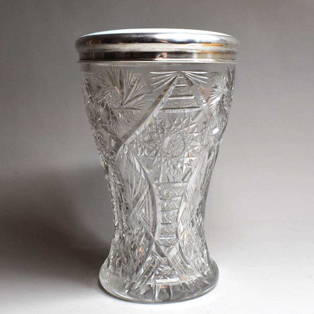 A large Austrian cut glass jar with silver guilloche lid: A large antique Austrian cut glass jar with silver guilloche lid featuring a portrait of a maiden. The lid stamped '835' for .835 silver. Austria, circa 1910. Approximate measurements: 8 5/8"H x 5 1/2