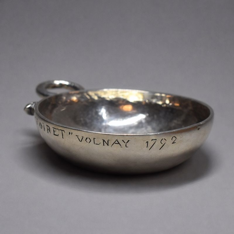 An antique French silver wine tester, 'tastevin' with snake-form handle: An antique French solid silver wine tester, 'tastevin' with snake-form handle inscribed ' Voiret Volnay 1792' ( likely refers to a Pinot Noir wine from the Volnay appellation in Cote de Beaune, Burgun