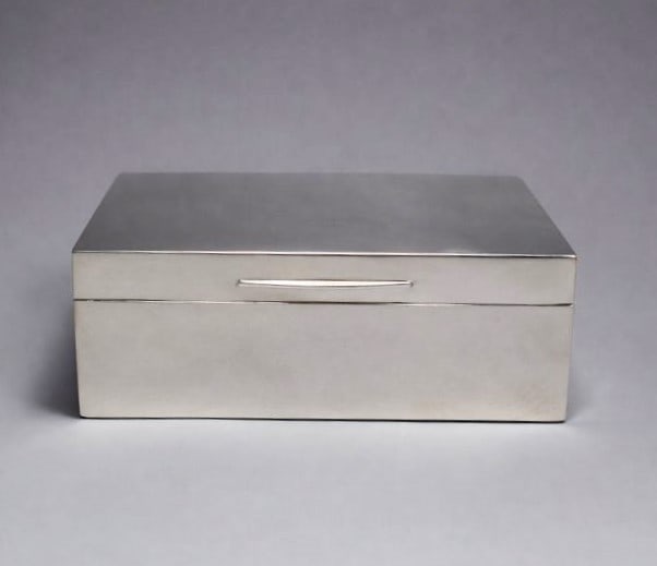 English Art Deco sterling silver cigar/cigarette box by MAPPIN & WEBB: An English Art Deco sterling silver cigar/cigarette hinged box with fitted wood interior by Mappin & Webb. London silver hallmarks, maker's marks for Mappin and Webb and date letter for 1946 on the ri