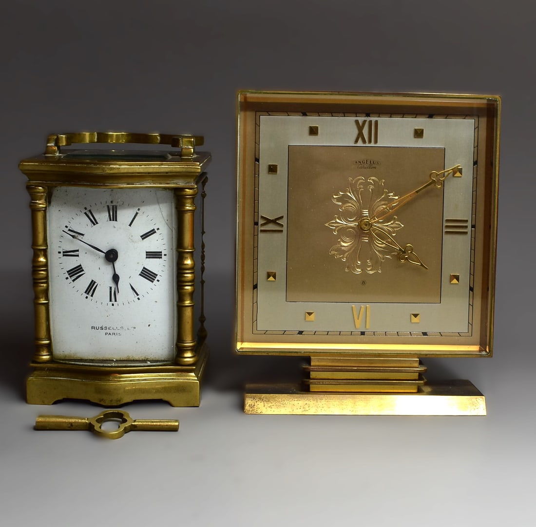 A retro Angelus Carillon alarm clock circa 1950 and a French brass carriage clock, Russells LTD.: A grouping of two table clocks including a retro Swiss-made Angelus Carillon alarm clock circa 1950, marked with Angelus Carillon manufacturer's mark and numbered '445' on the underside (5 1/2"H x 4 3