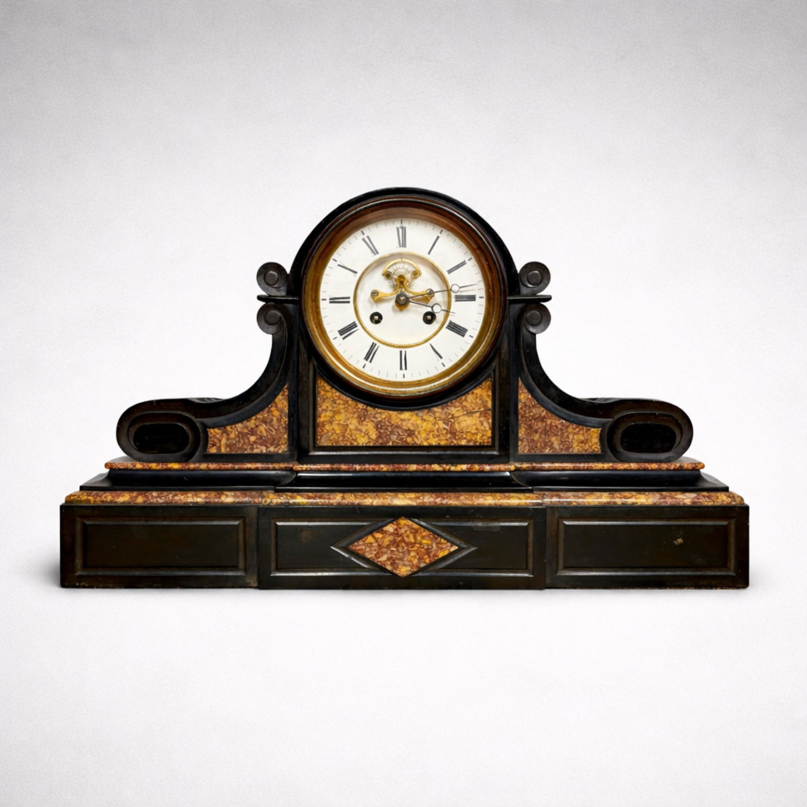 A Large 19th cent. marble and slate mantel clock: A large 19th century Victorian marble and slate mantel clock, the fluted cylindrical case flanked by downswept fluted scrolls, raised on a plinth base. No winding key. From a Scarsdale, NY estate. App