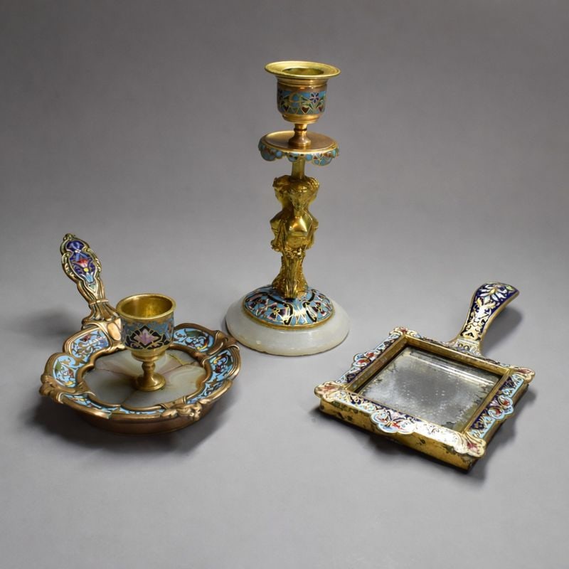 Grouping of three antique French bronze and champleve enamel lots including a candlestick: Grouping of three antique French gilt bronze champleve enamel lots including a candlestick, a chamberstick with onyx and a hand mirror. Approximate measurements ( candlestick only / for scale): 6 1/4"
