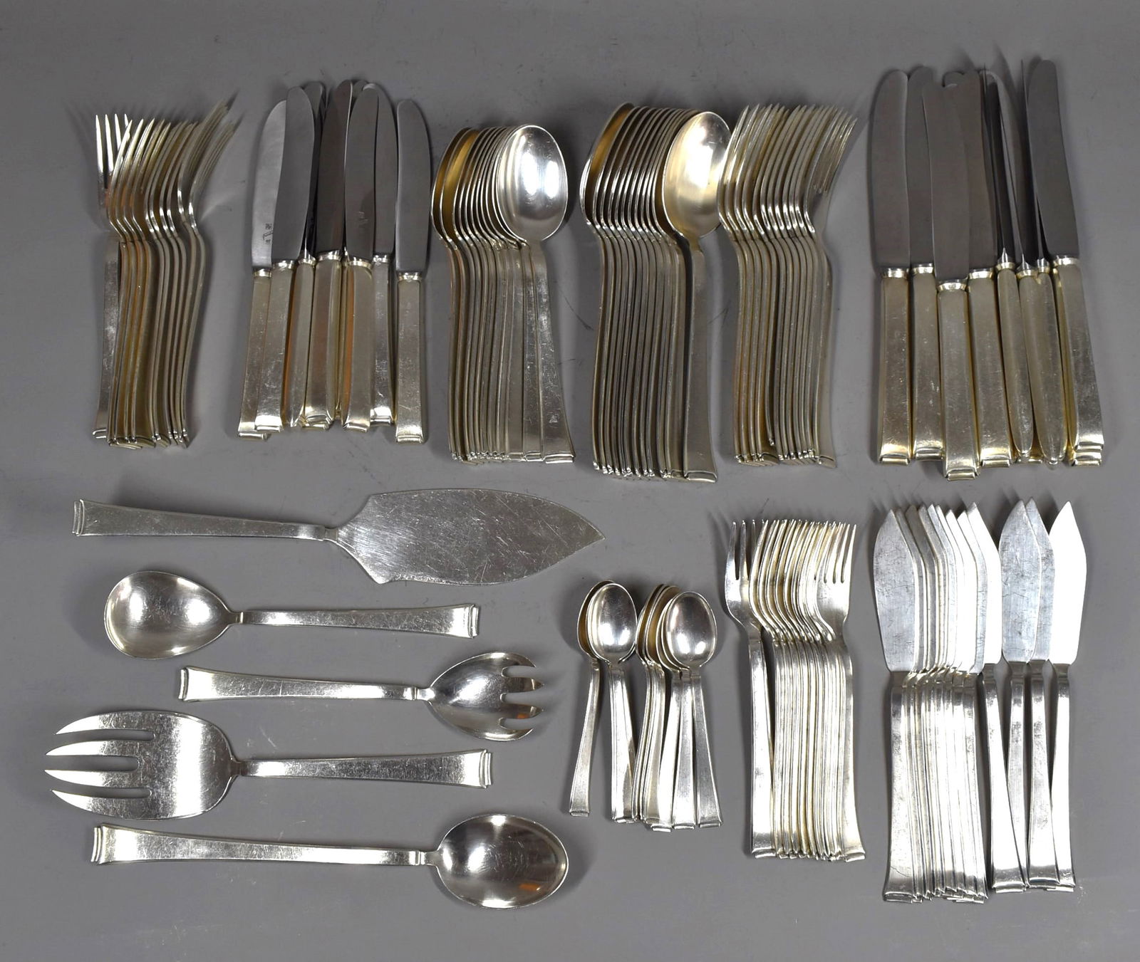 A 107-piece WMF German Art Deco silver plate flatware service for 12: A WMF German Art Deco silver plate 107-piece partial flatware service for 12 circa 1935. Comprised of: 12 Dinner forks (8"L or 20.2cm L) 12 Dinner knives (9 1/8"L or 23cm L) 12 Soup spoons (8"L or 20.