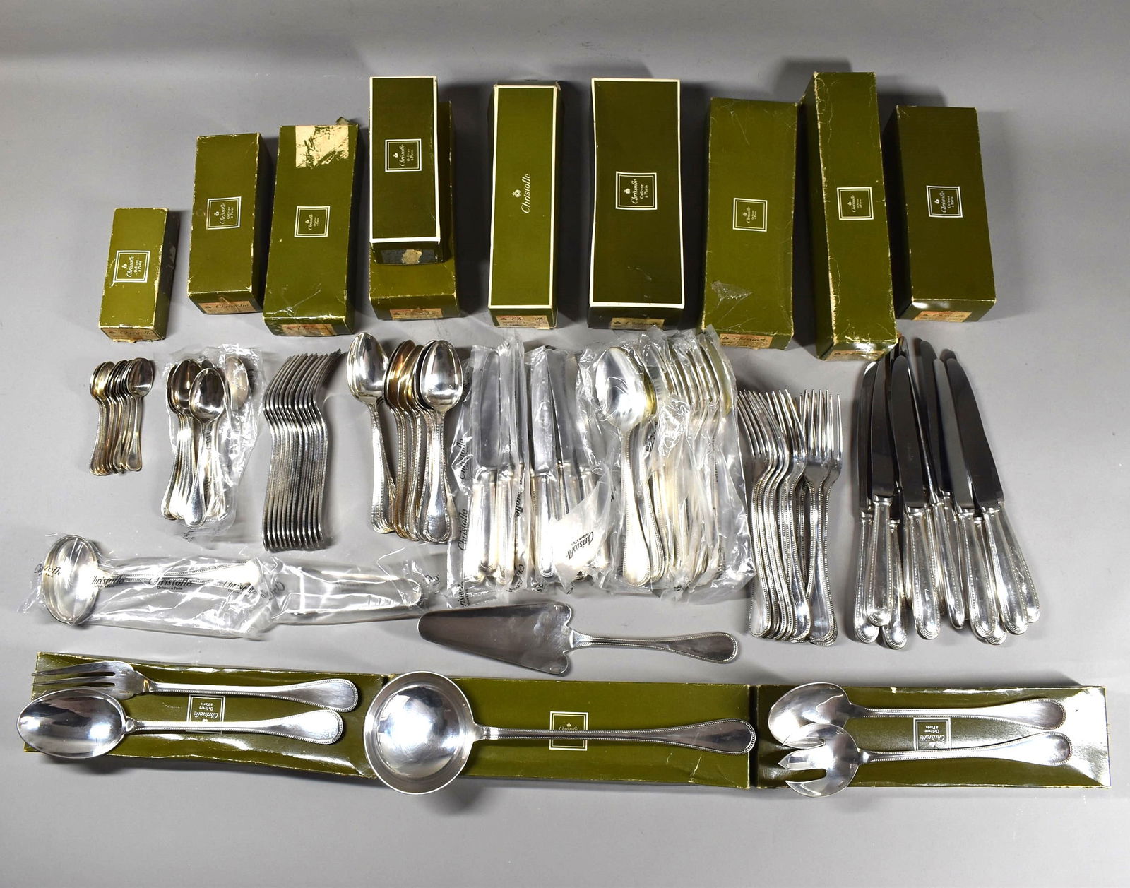 A vintage CHRISTOFLE 'Perles' pattern 104-piece flatware service for 12: A vintage Christofle silver plate partial flatware service for 12 totalling 104 pieces including: 12 Dinner forks (8 1/8"L) 12 Dinner knives (9 5/8"L) 12 Large soup spoons (8"L) 12 Dessert forks (6 1/