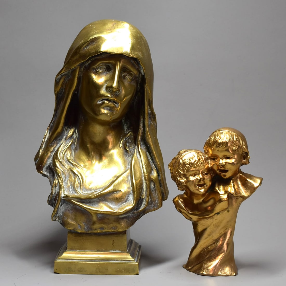Eugene Marioton (French 1854-1925) and Jeanne CHATEIGNON (1876-1950) bronzes: A grouping of two antique French Art Nouveau period gilt bronzes including a bronze bust of the Virgin signed Marioton on the back for Eugene Marioton (French 1854-1925) numbered 136 (9 1/4"H x 5"W x