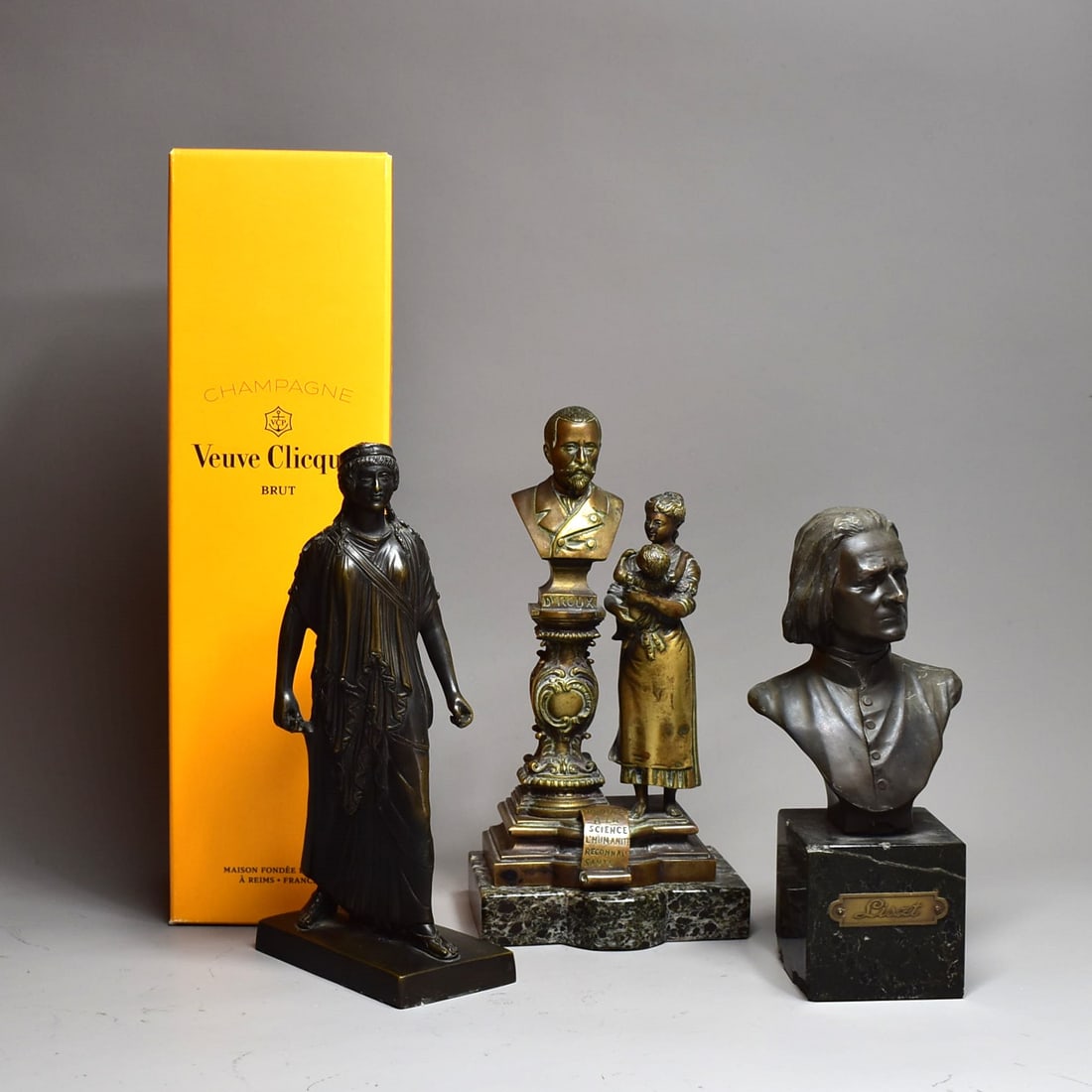 A grouping of three antique sculptures, Bronze and spelter: A grouping of three antique bronze sculptures including an antique French bronze group titled 'Hommage A La Science L'Humanite reconnaissante' signed Perron (9"H x 4 1/4"W x 3 1/2"D), a patinated spel