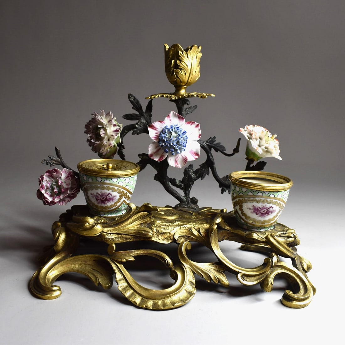 Rococo style ormolu and porcelain inkstand / candlestick circa 1900: A Rococo style ormolu and porcelain inkstand/ candle holder circa 1900, in the style of 18th century Louis XV meissen mounted inkstands. Probably french, circa 1900. Apparently un-marked. Approximate