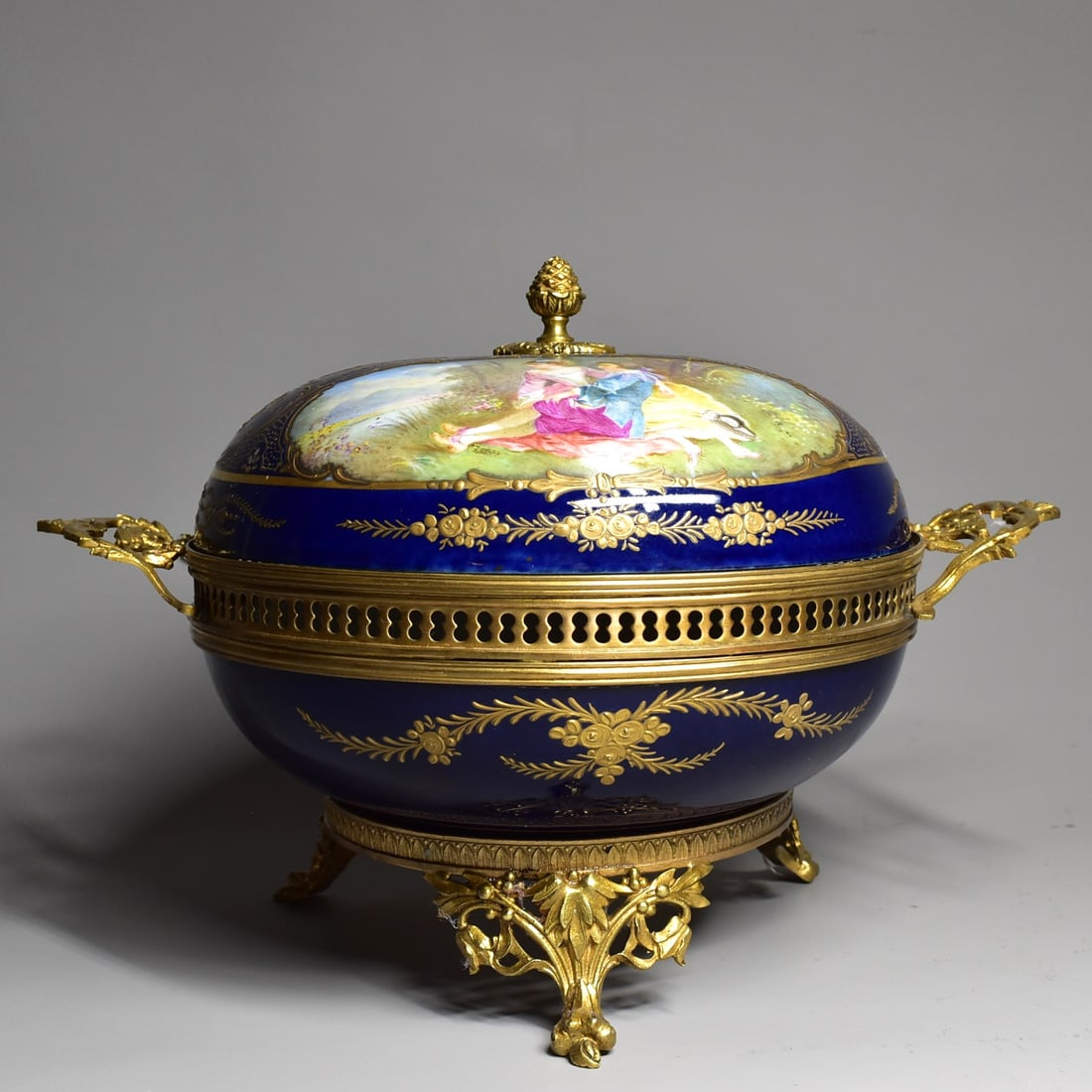 A large ormolu-mounted SEVRES porcelain Potpourri: A large antique or vintage Sevres 'Chateau des Tuileries' cobalt-blue ground porcelain Potpourri / box and cover. Marked on the underside with the red Chateau des Tuileries mark and a blue Sevres/ Sev