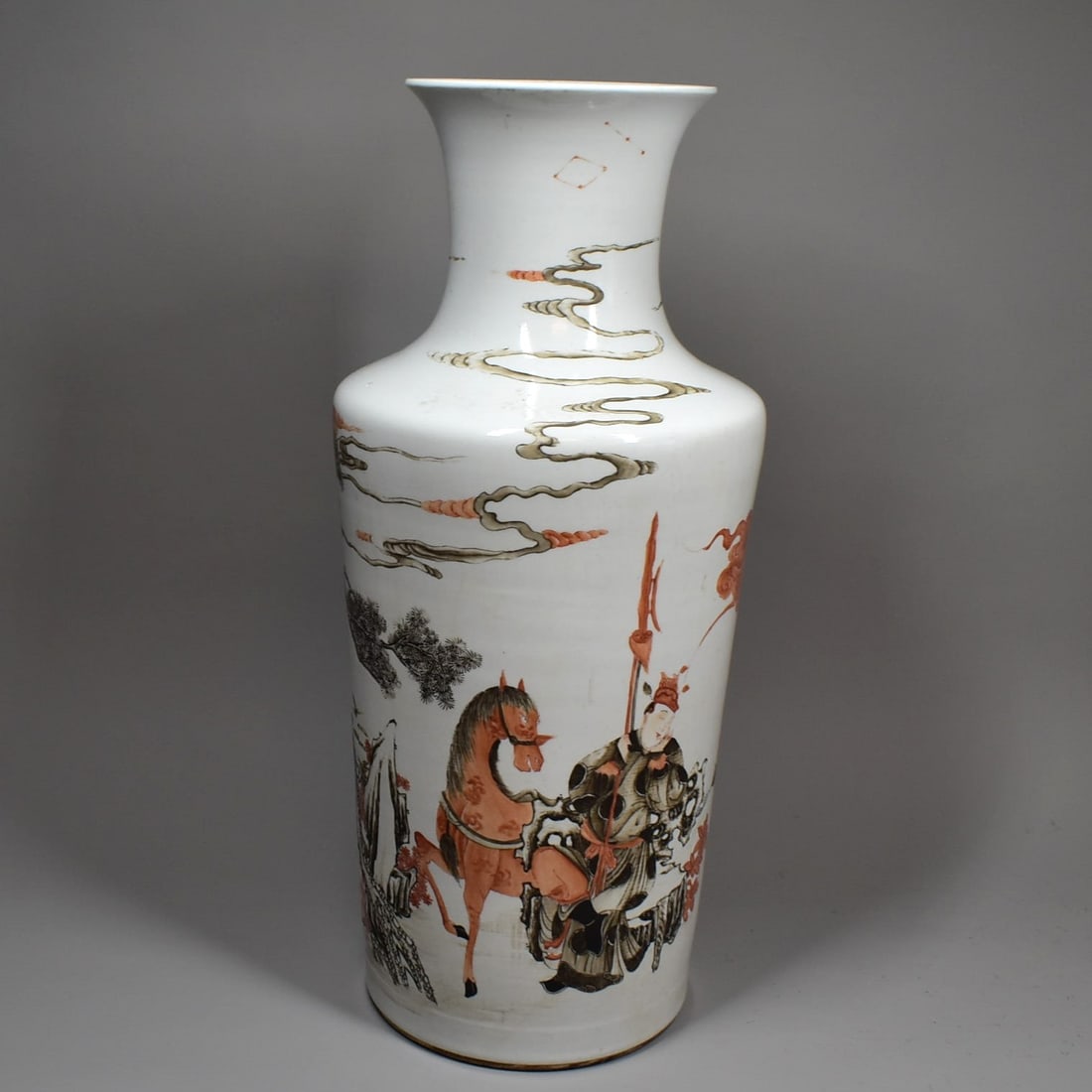 Large Chinese iron-red and 'en grisaille' baluster vase, Qing Dynasty, early 19th century: A large Chinese iron-red and 'en grisaille' baluster vase, Qing Dynasty, early 19th century, with continuous decoration featuring people and horse in a landscape outside crenelated walls, with stylize