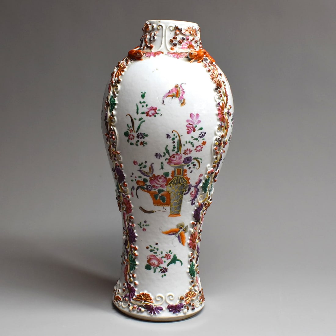 Antique Chinese export Mandarin palette porcelain famille rose vase, Qing Dynasty: An antique Chinese export porcelain famille rose vase/ jar in the mandarin palette, with raised motifs featuring squirrels and grape vines. Late 18th/early 19th century. Approximate measurements: 10"H