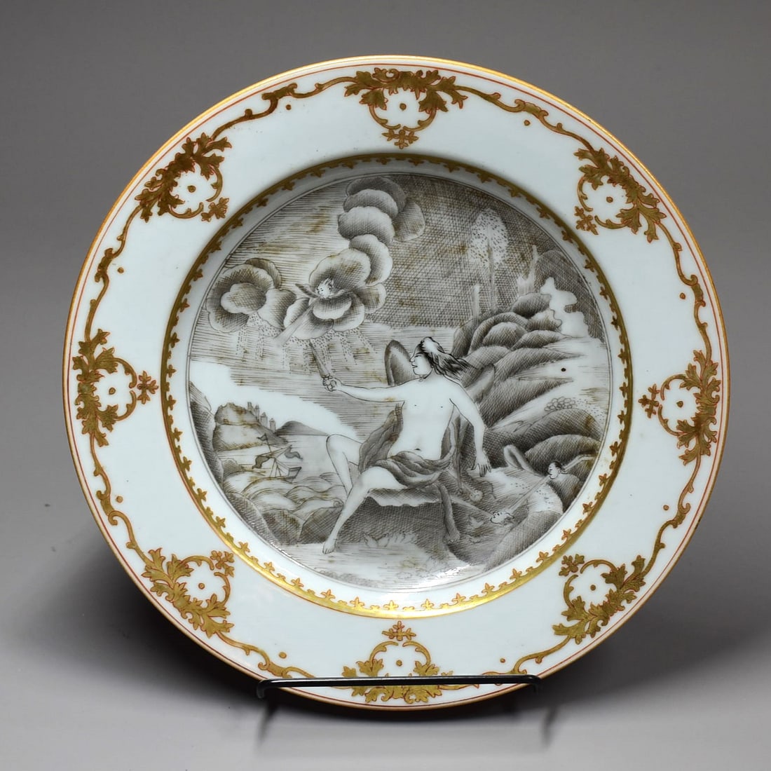 A Chinese export porcelain dish with 'en grisaille' mythological scene: A Chinese export porcelain dish with a 'en grisaille' European mythological scene and gilt decorated border. Qing Dynasty, late 18th/early 19th century. Approximate measurements: 8 3/4" in diameter or