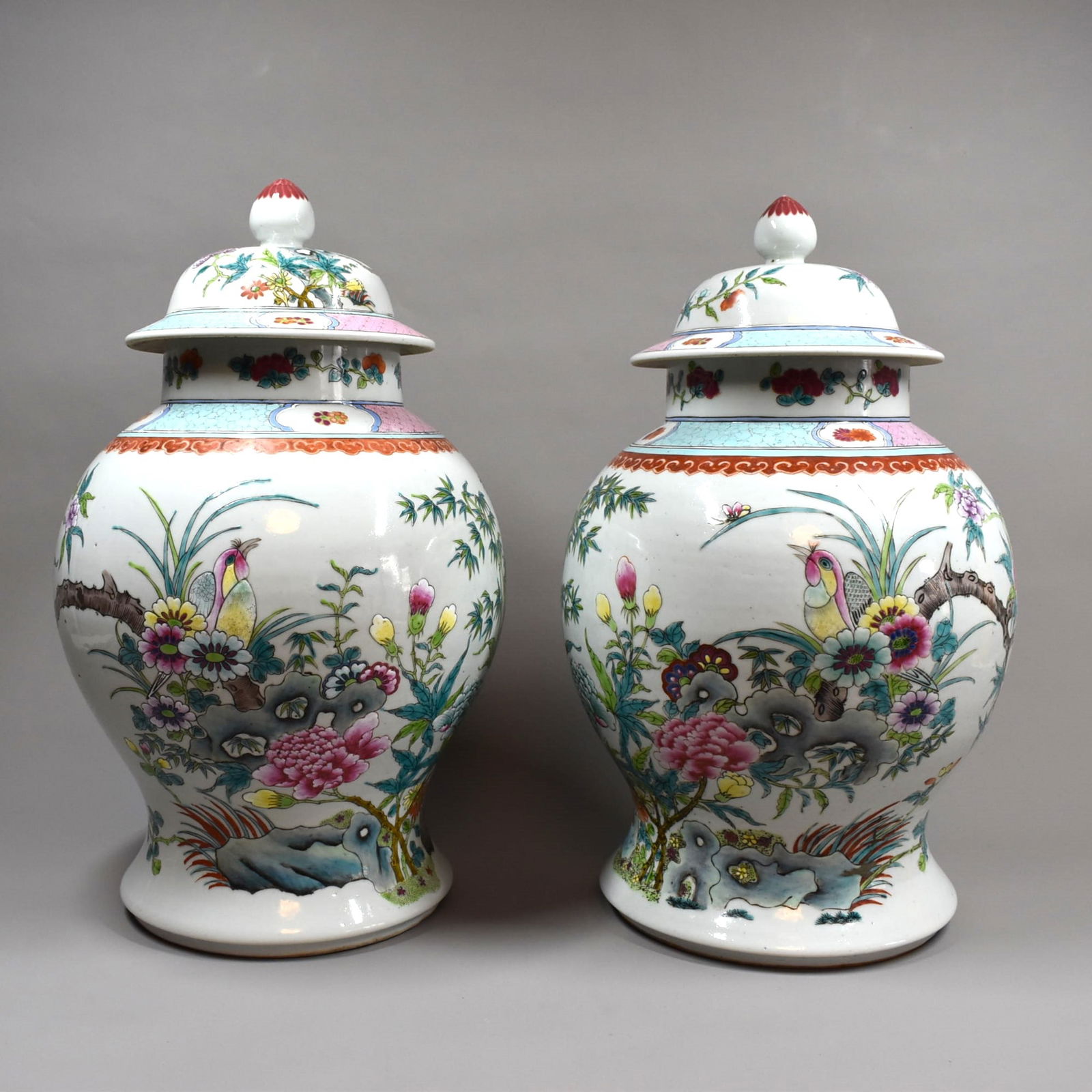 Large pair of Chinese famille rose porcelain vases and covers: A large matching pair of Chinese famille rose porcelain vases and covers, decorated with flowers birds and insects. 19th /20th century. From an Old Westbury NY estate. This Lot is being offered again