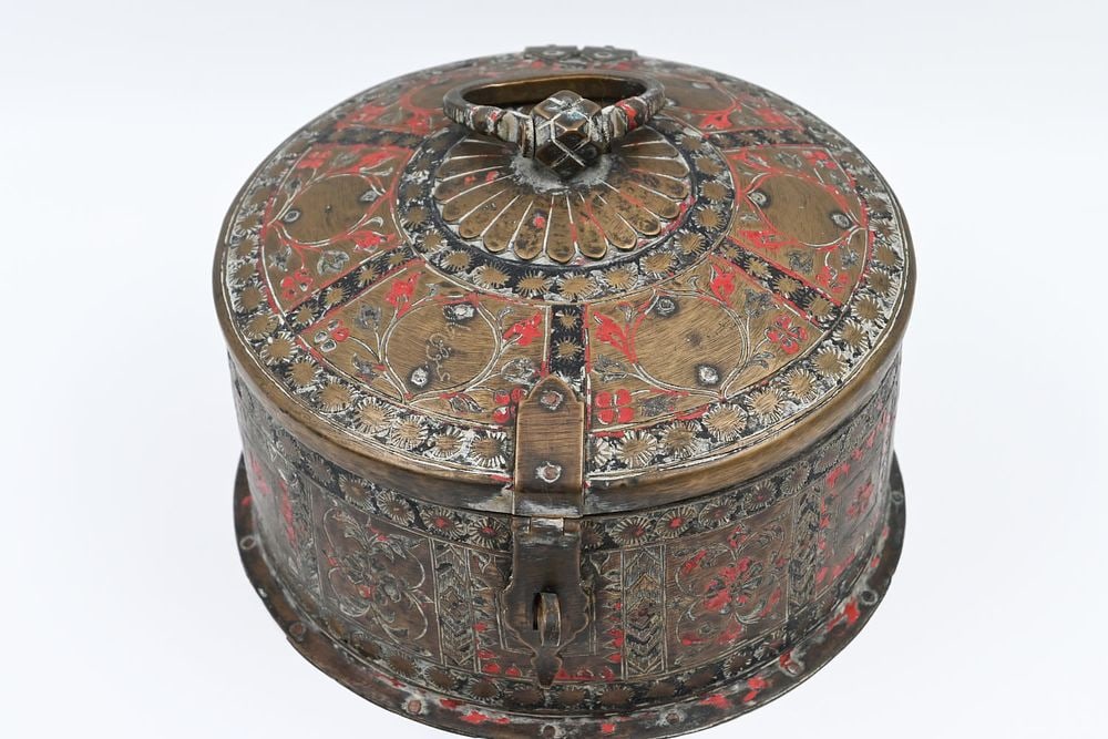 Islam. A brass drying vessel decorated with email and engraving work combined with vegetation , (1 of 4)