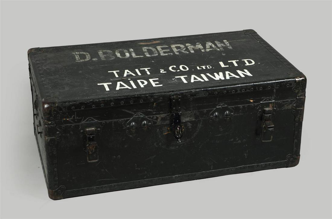 An old travel chest with the inscription "D.Bolderman Tait: An old travel chest with the inscription "D.Bolderman Tait & Co LTD Taipe Taiwan". Added to this is a collection of beer glasses.