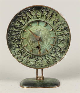 A bronze table clock, Professor Fritz Nuss for Kienzle. Ger: A bronze table clock, Professor Fritz Nuss for Kienzle. Germany, circa 1940.Diam.: 19 cm.