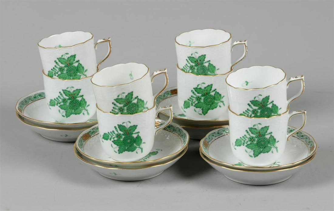 A set of porcelain cups and saucers (coffee) with Apponyi g: A set of porcelain cups and saucers (coffee) with Apponyi green decor. Herend, late 20th century.