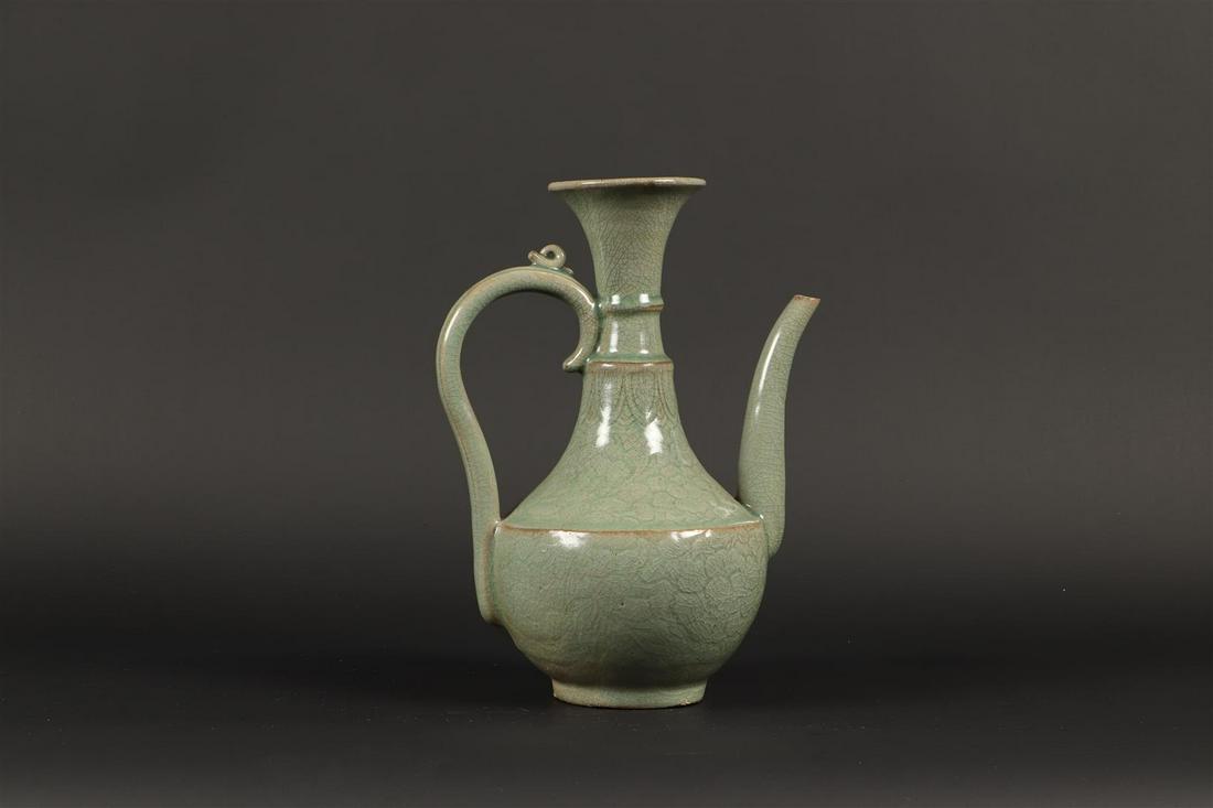 A celadon pitcher. Korea, 15th century or later. H.: 28,5 c (1 of 4)