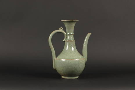 A celadon pitcher. Korea, 15th century or later. H.: 28,5 c: A celadon pitcher. Korea, 15th century or later.H.: 28,5 cm.