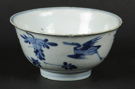 A porcelain bowl decorated with flying cranes, marked with: A porcelain bowl decorated with flying cranes, marked with a Taoist symbol. China, Kangxi.Diam.: 15,5 cm.