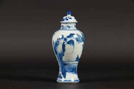 A porcelain vase with lid with flowers on rock decoration C: A porcelain vase with lid with flowers on rock decoration China, Kangxi.H.: 19 cm.