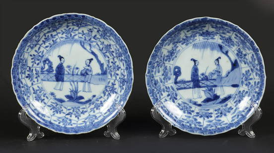 A set of porcelain plates with decoration of 2x long Elizas: A set of porcelain plates with decoration of 2x long Elizas at a fence in a landscape decor. China, Yongzheng.Diam.: 16 cm.