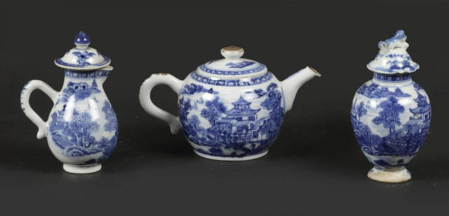 A small porcelain tea set; teapot, milk jug, tea caddy with: A small porcelain tea set; teapot, milk jug, tea caddy with river/pagoda decor. China, Qianglong.H.: 11 & 8 cm.
