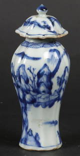 A porcelain baluster-shaped ribbed lid vase with landscape: A porcelain baluster-shaped ribbed lid vase with landscape design. China, Yongzheng.H.: 15 cm.
