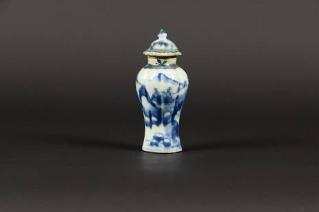 A porcelain baluster-shaped lid vase with mountain landscap: A porcelain baluster-shaped lid vase with mountain landscape decoration. China, Qianglong.H.: 12 cm.