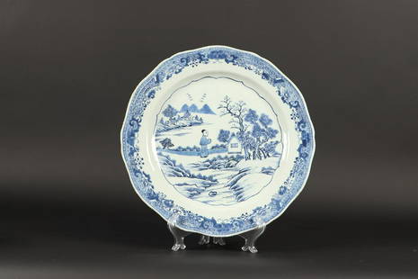 A porcelain dish with landscape decor. China, Qianglong. Di: A porcelain dish with landscape decor. China, Qianglong.Diam.: 38 cm.