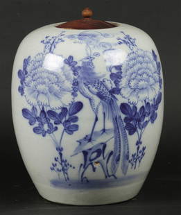 A porcelain lidded pot decorated with a pheasant in a lands: A porcelain lidded pot decorated with a pheasant in a landscape. China, late 19th century.H.: 29 cm.