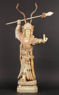 A large leg sculpture of a female warrior. China, 2nd half: A large leg sculpture of a female warrior. China, 2nd half 20th century.Spear gluedH.: 88 cm.