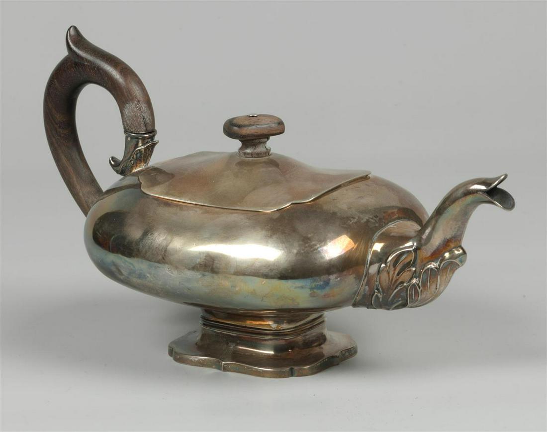 A silver teapot with wooden handle and knob, Bonebakker & S: A silver teapot with wooden handle and knob, Bonebakker & Son Amstedam 2nd half 20th century. 410 grams (bruto).