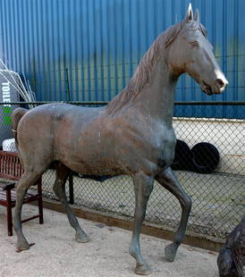 A life size garden bronze of a stallion, 20th. C. H.: 230: A life size garden bronze of a stallion, 20th. C. H.: 230 x L.: 250 cm.