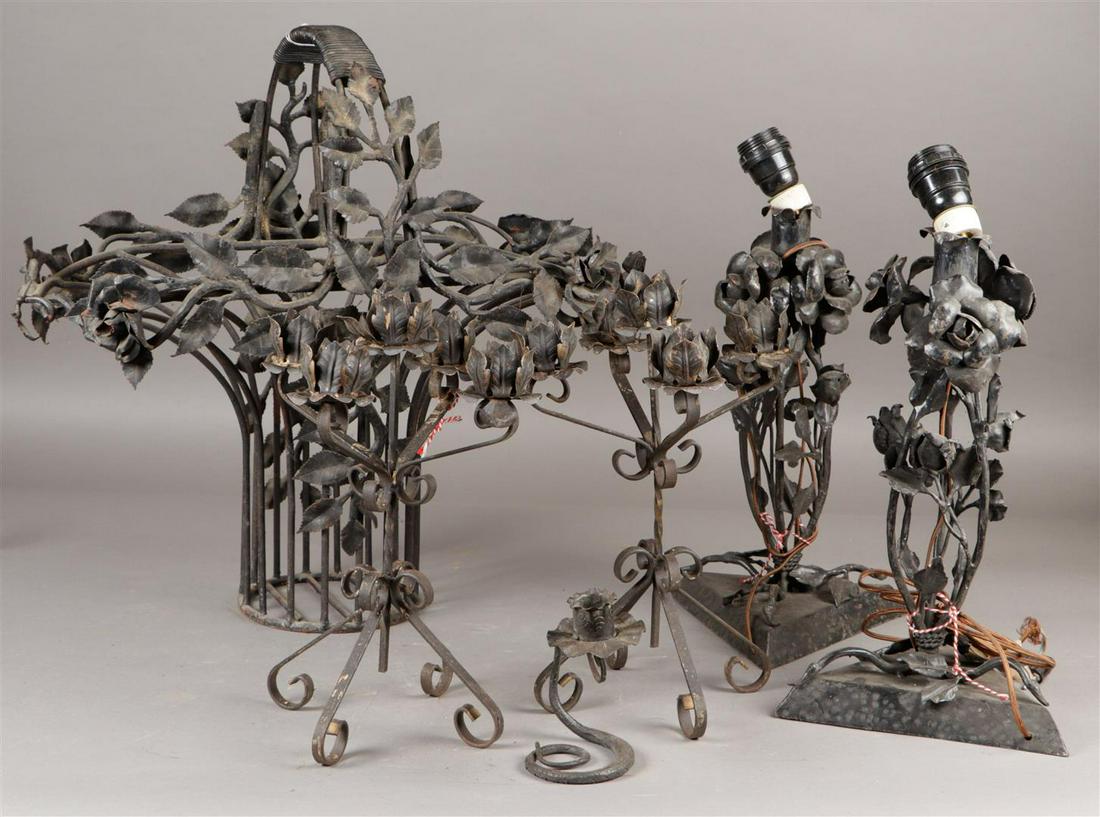 A lot of wrought iron decorative objects including a flower: A lot of wrought iron decorative objects including a flower basket, candlesticks and lamp bases.