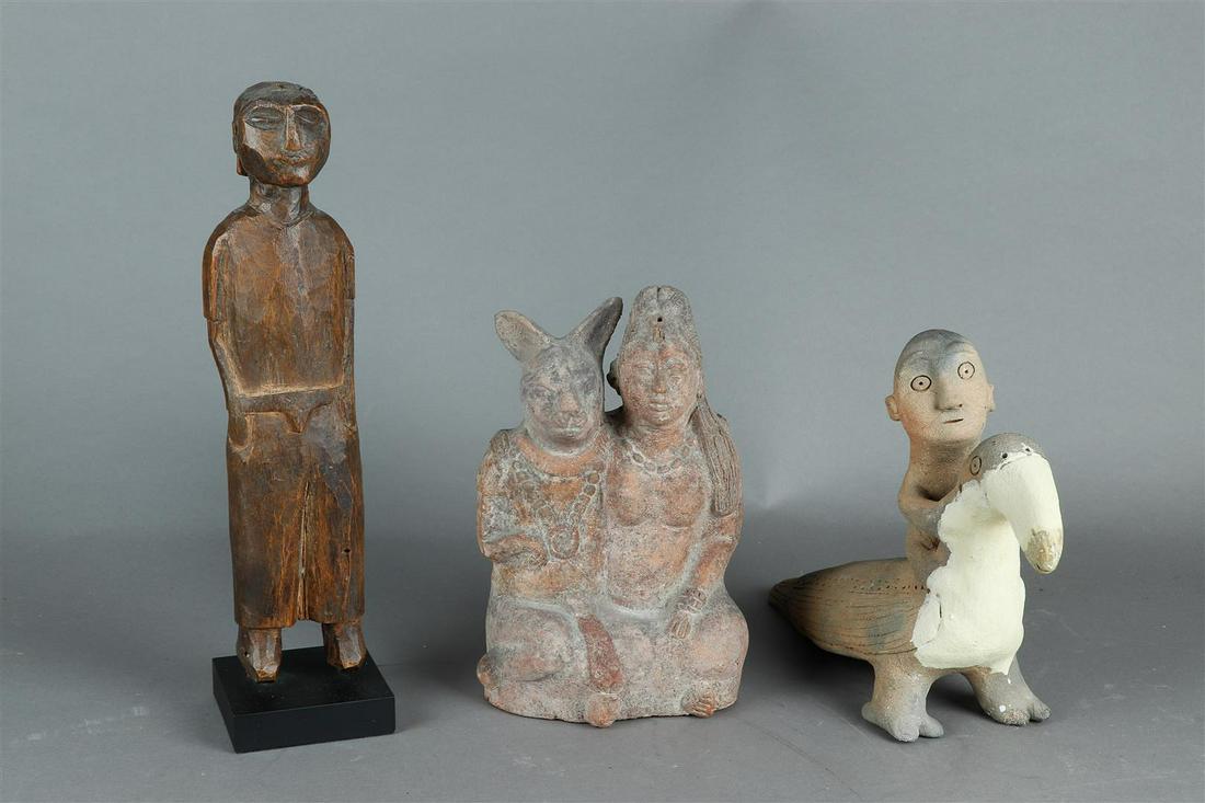 A lot consisting of (2) terracotta groups. A woman with a hare, and a bird rider. (1 of 1)
