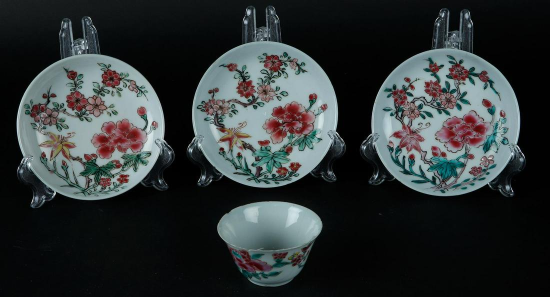 Three porcelain Famille Rose plates and a cup with rich floral decoration. China, Yongzheng. (1 of 2)