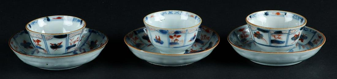 Three porcelain Imari cups and saucers with butterfly decor and floral decor, center with fisherman (1 of 4)