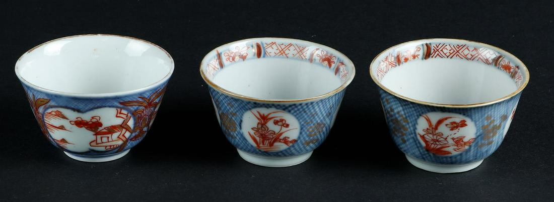 Three porcelain bowls with milk-and-blood decoration of openwork beds: Three porcelain bowls with milk-and-blood decoration of openwork beds, outside with floral decoration and landscapes. China, Yongzheng.Diam.: 6 cm.