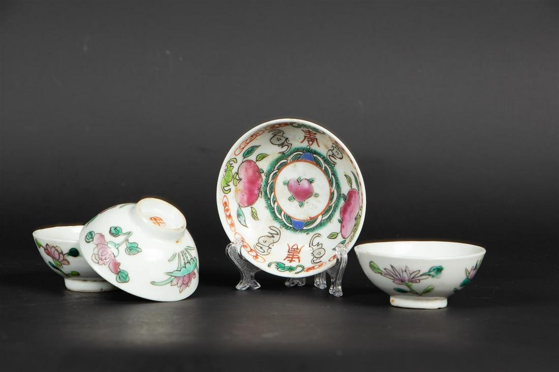 A set of three porcelain cups and saucers with floral decor. China, Tongzhi. (1 of 2)