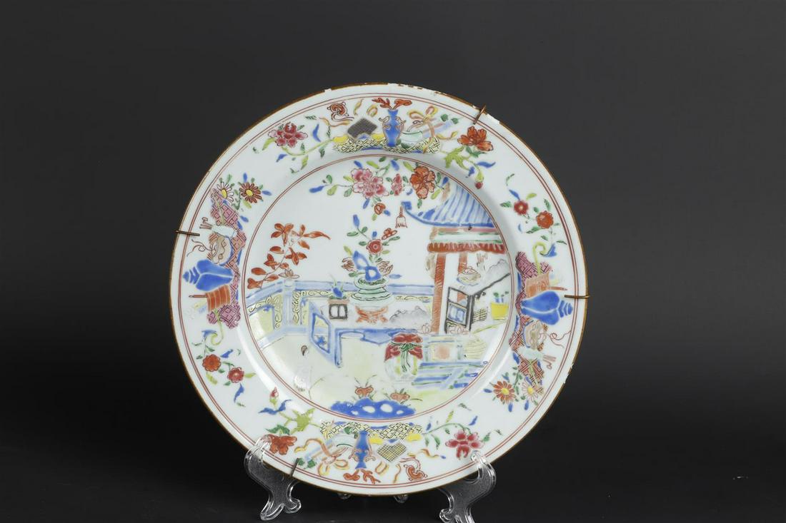 A porcelain Famille Rose plate with decoration of a pavilion with fence decor (1 of 2)