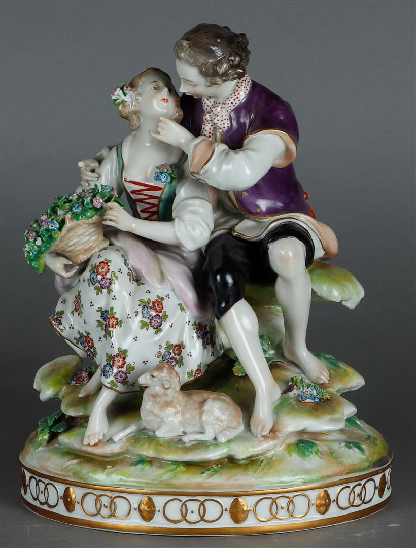 A porcelain group of an elegant couple with a sheep in the foreground, on an oval base. (1 of 3)