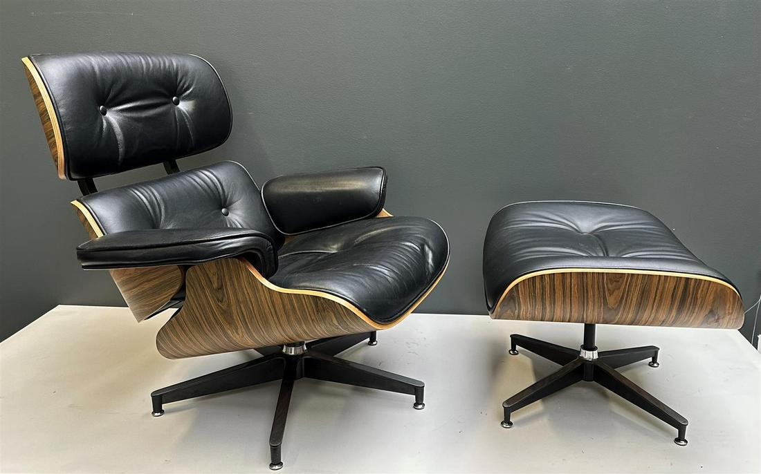A black leather designer chair with ottoman inspired by Charles & Ray Eames (1 of 5)